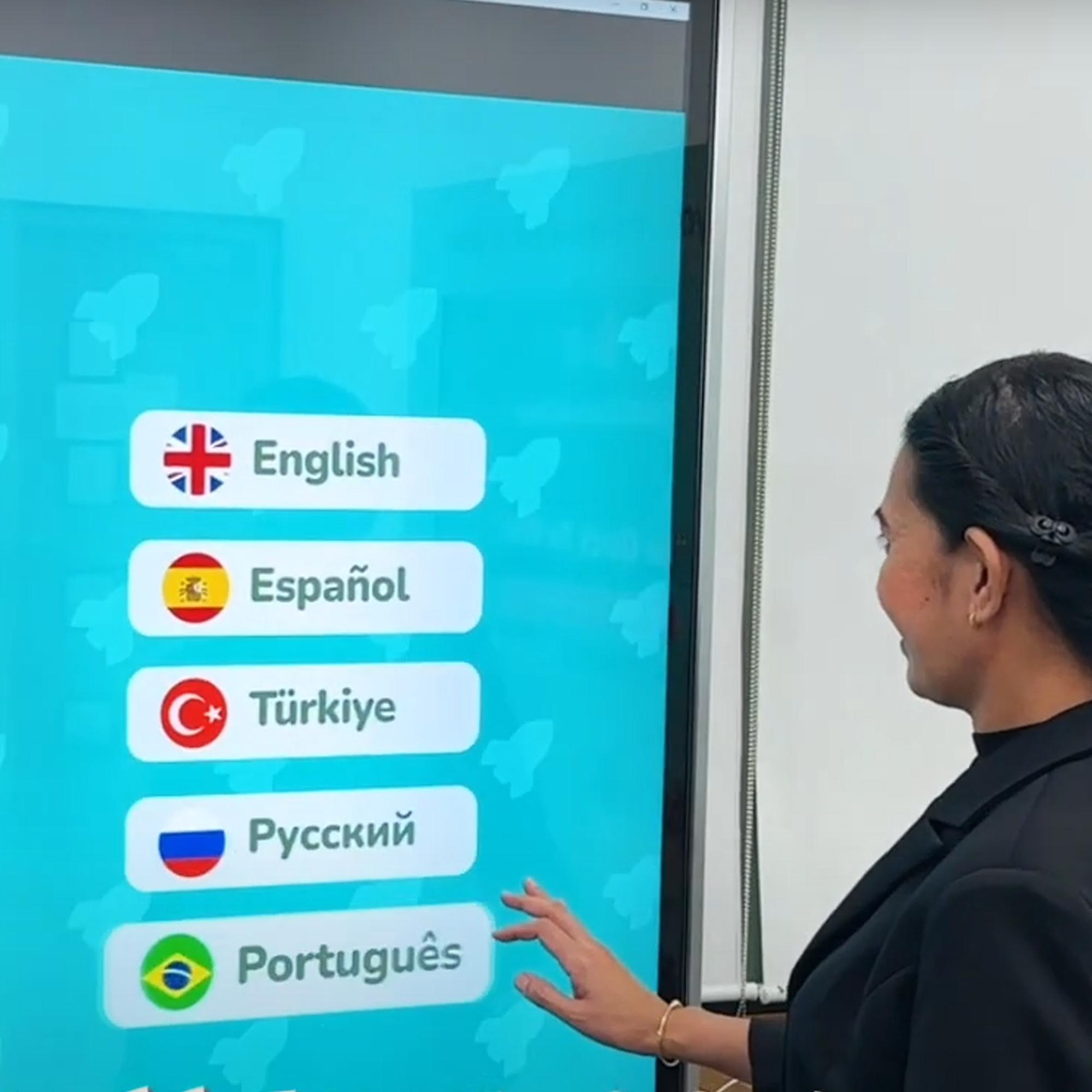 Participants playing the interactive Guess the Flag game at an event, engaging with a fun, branded quiz experience that tests geographical knowledge in a lively setting.